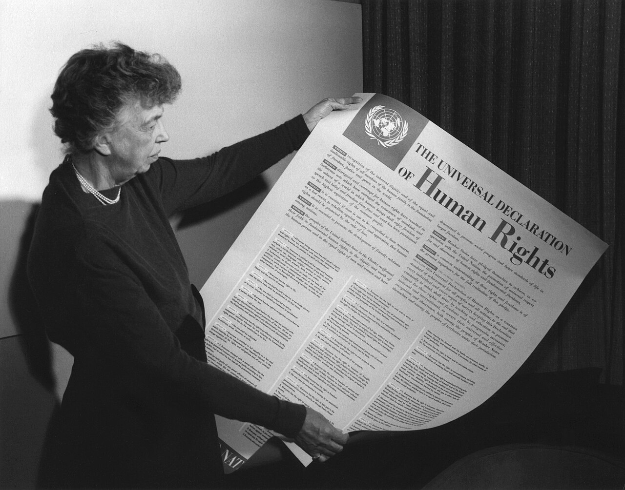 Eleanor Roosevelt holding the Universal Declaration of Human Rights in 1949. © Wikimedia.org